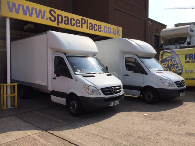 Two Newby Removals Luton vans outside a storage facility